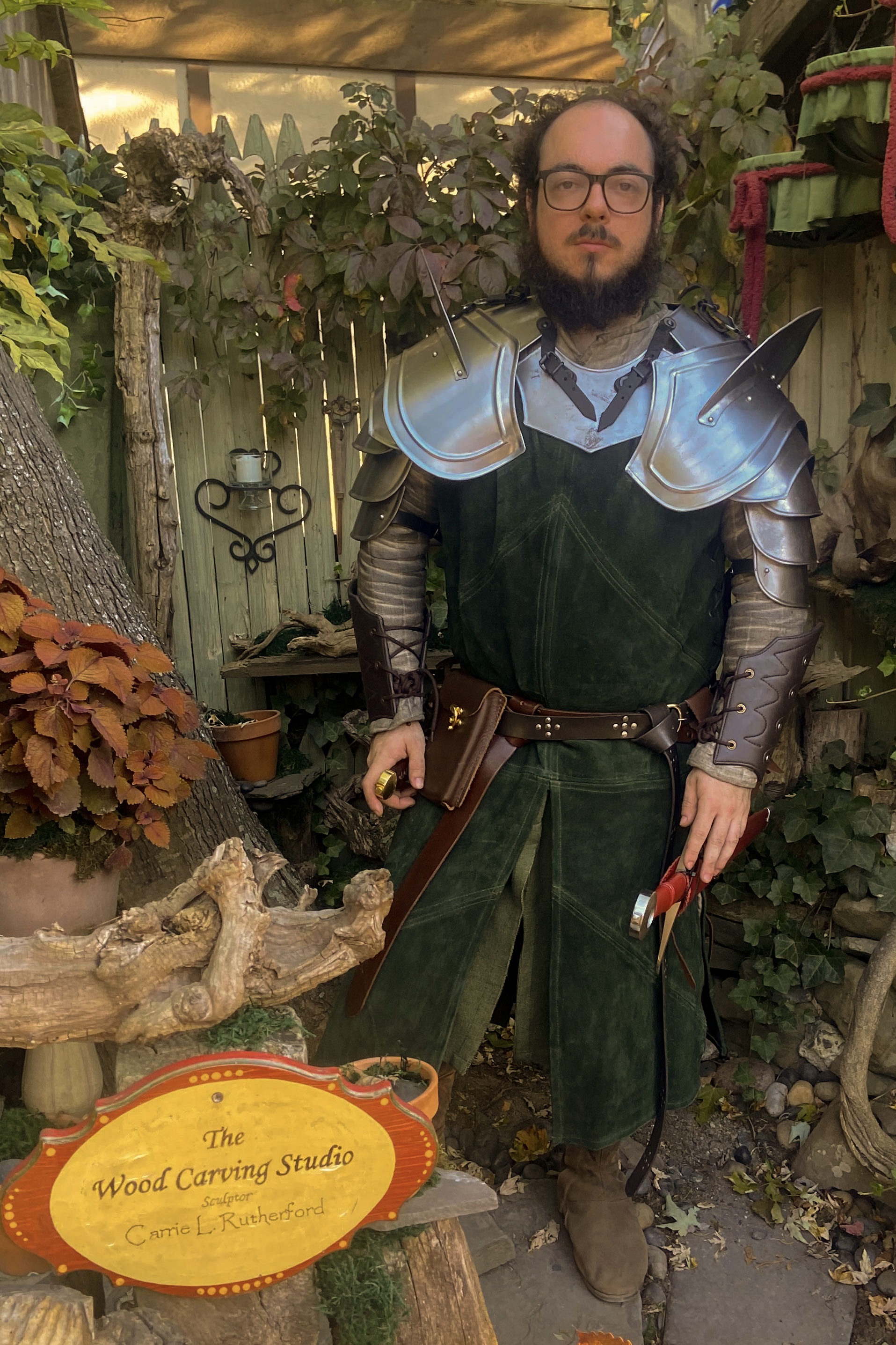 A fighter stands in an autumnul garden